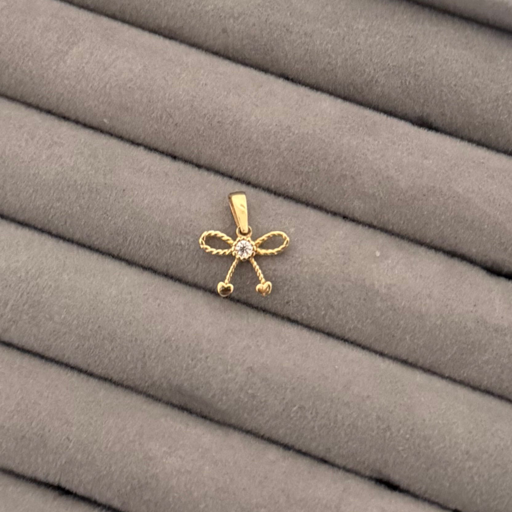 Yellow Gold Zircon Bow Pendant with Heart Accents