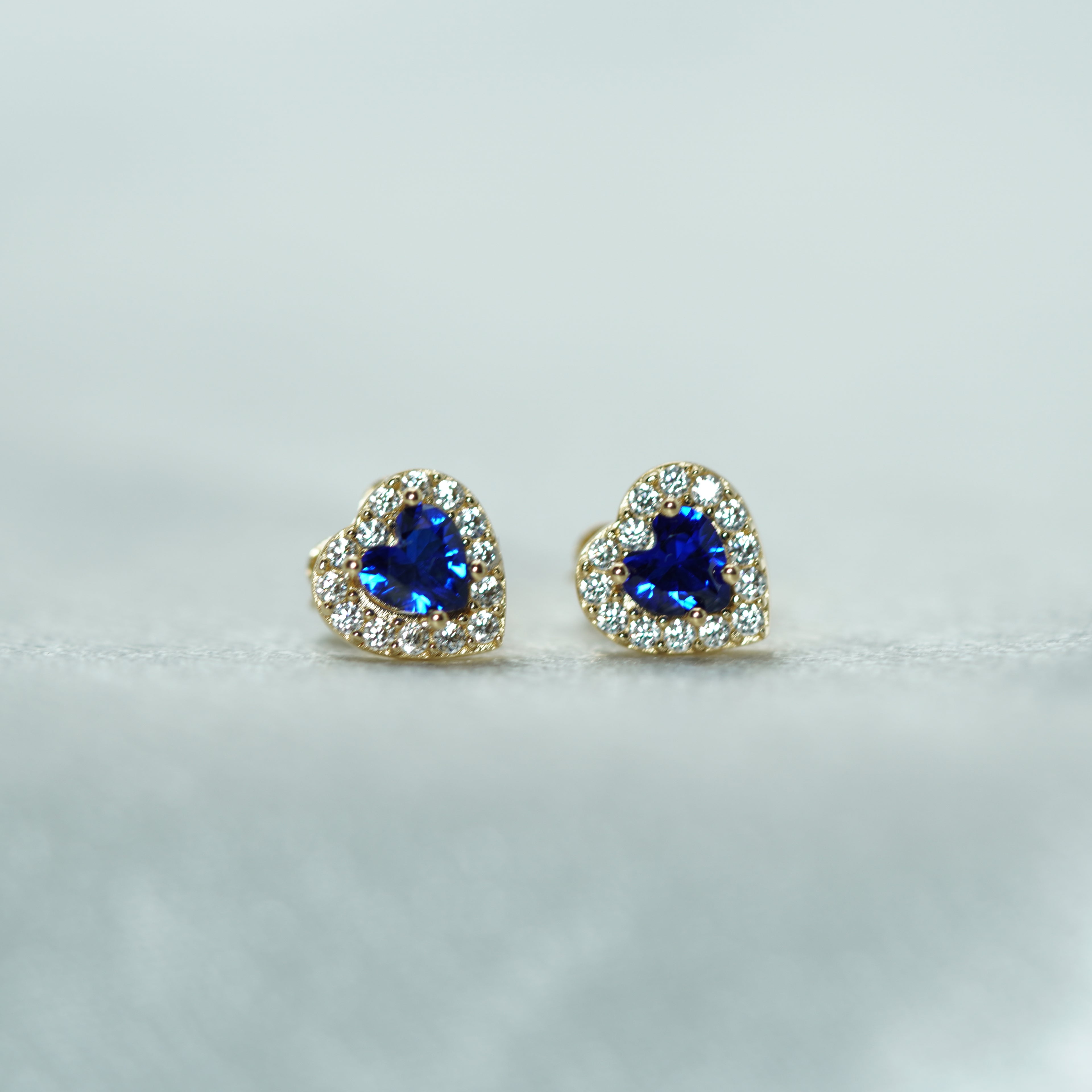 Heart-Shaped Blue Zircon Halo Stud Earrings in Yellow Gold