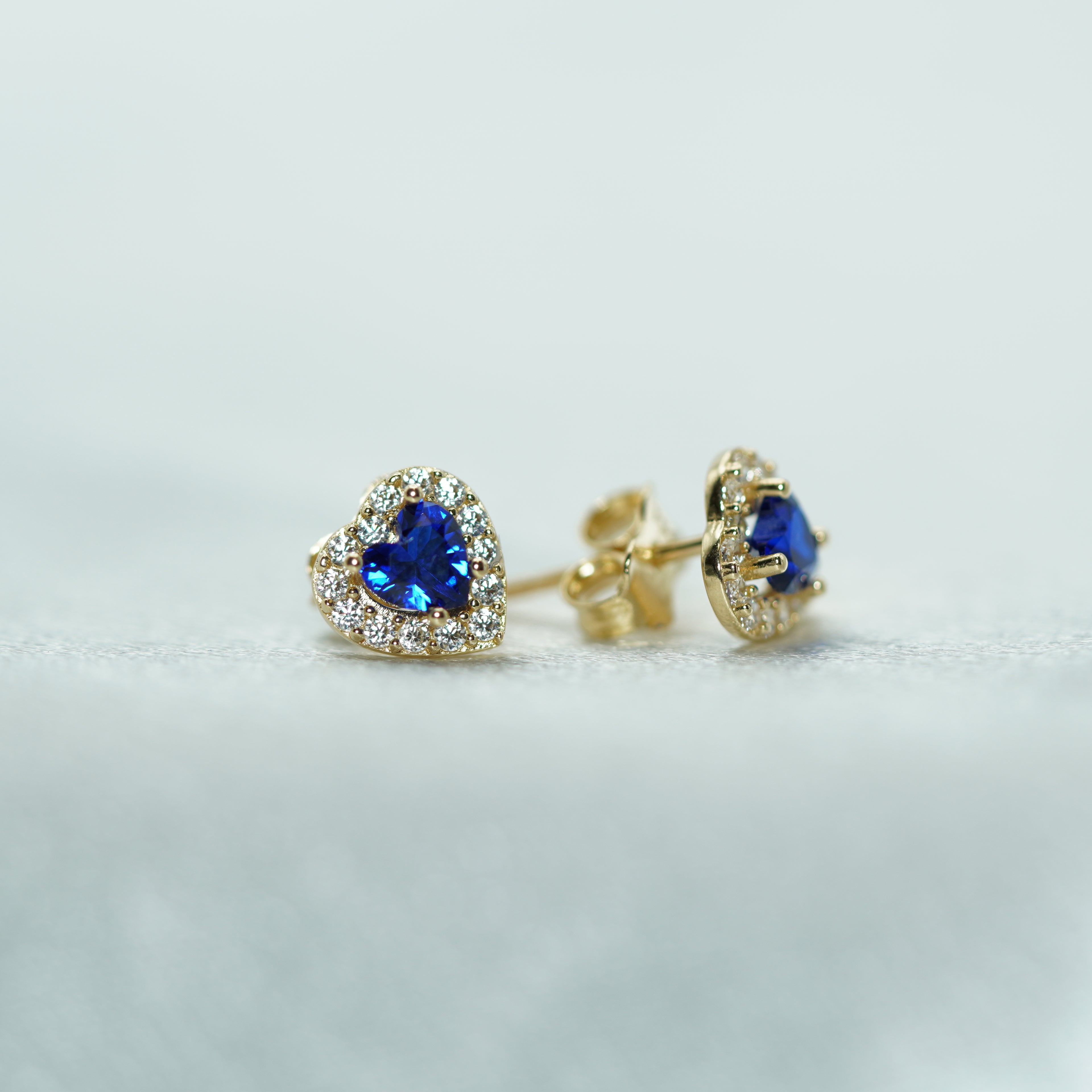 Heart-Shaped Blue Zircon Halo Stud Earrings in Yellow Gold