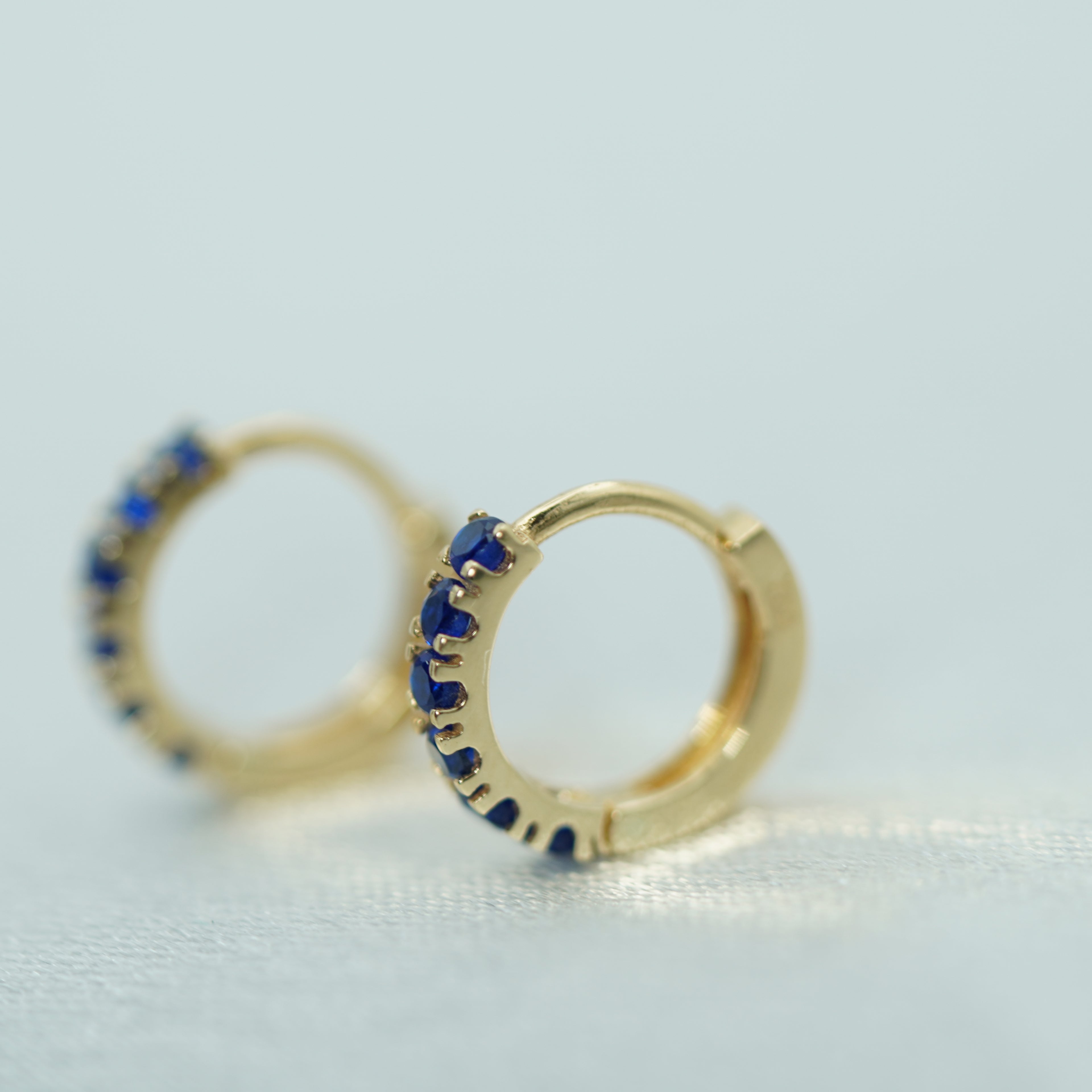 Vivid Blue Sapphire Hoop Earrings in Yellow Gold