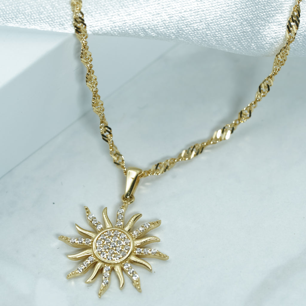 Zirconia Sunburst Charm Necklace in Yellow Gold