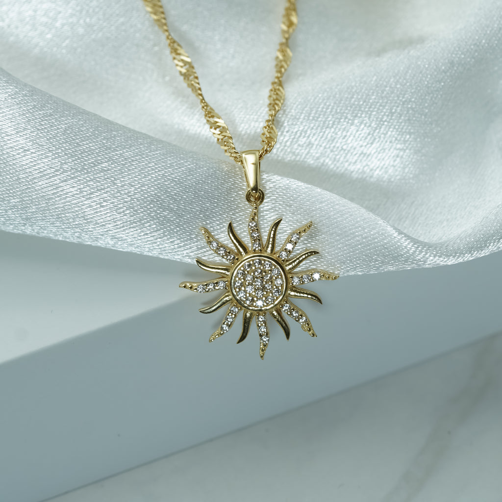 Zirconia Sunburst Charm Necklace in Yellow Gold