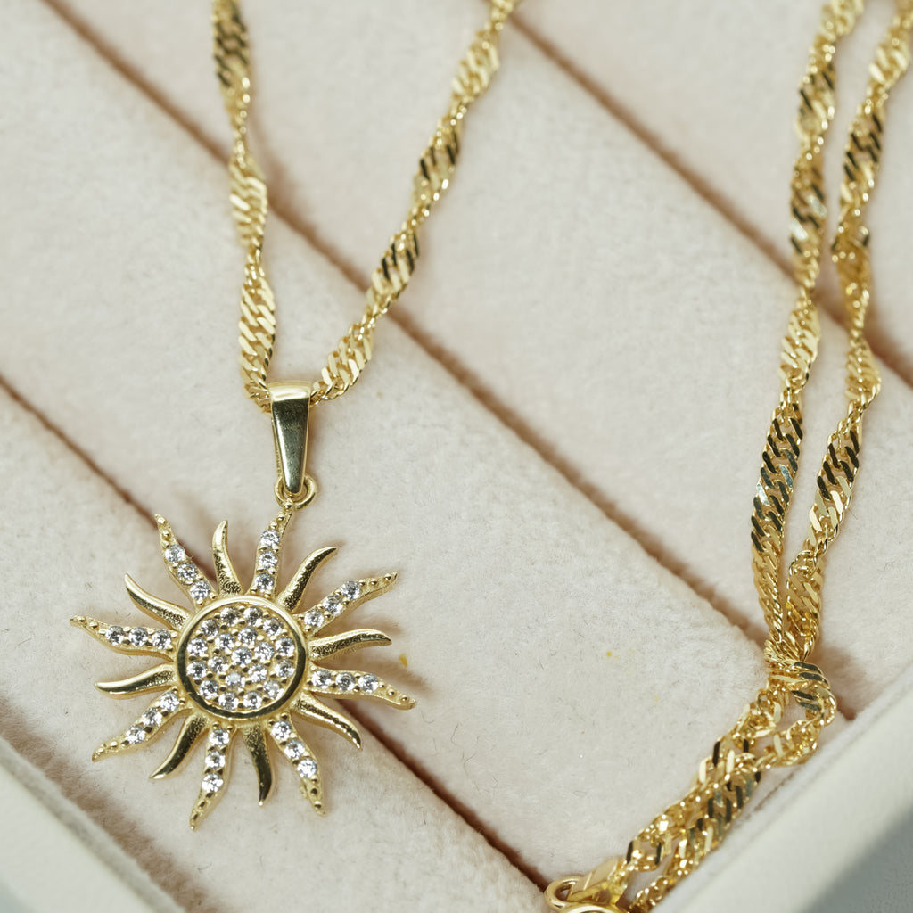 Zirconia Sunburst Charm Necklace in Yellow Gold
