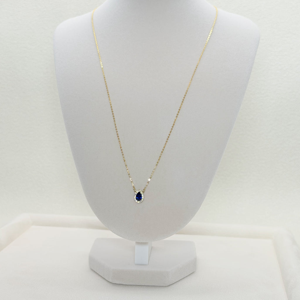 Pear-Shaped Blue Zircon Halo Charm Necklace in Yellow Gold