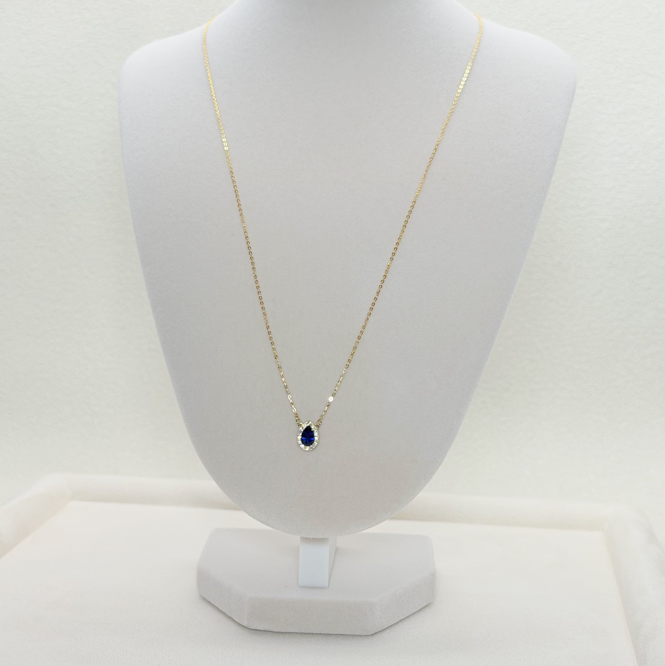 Pear-Shaped Blue Zircon Halo Charm Necklace in Yellow Gold