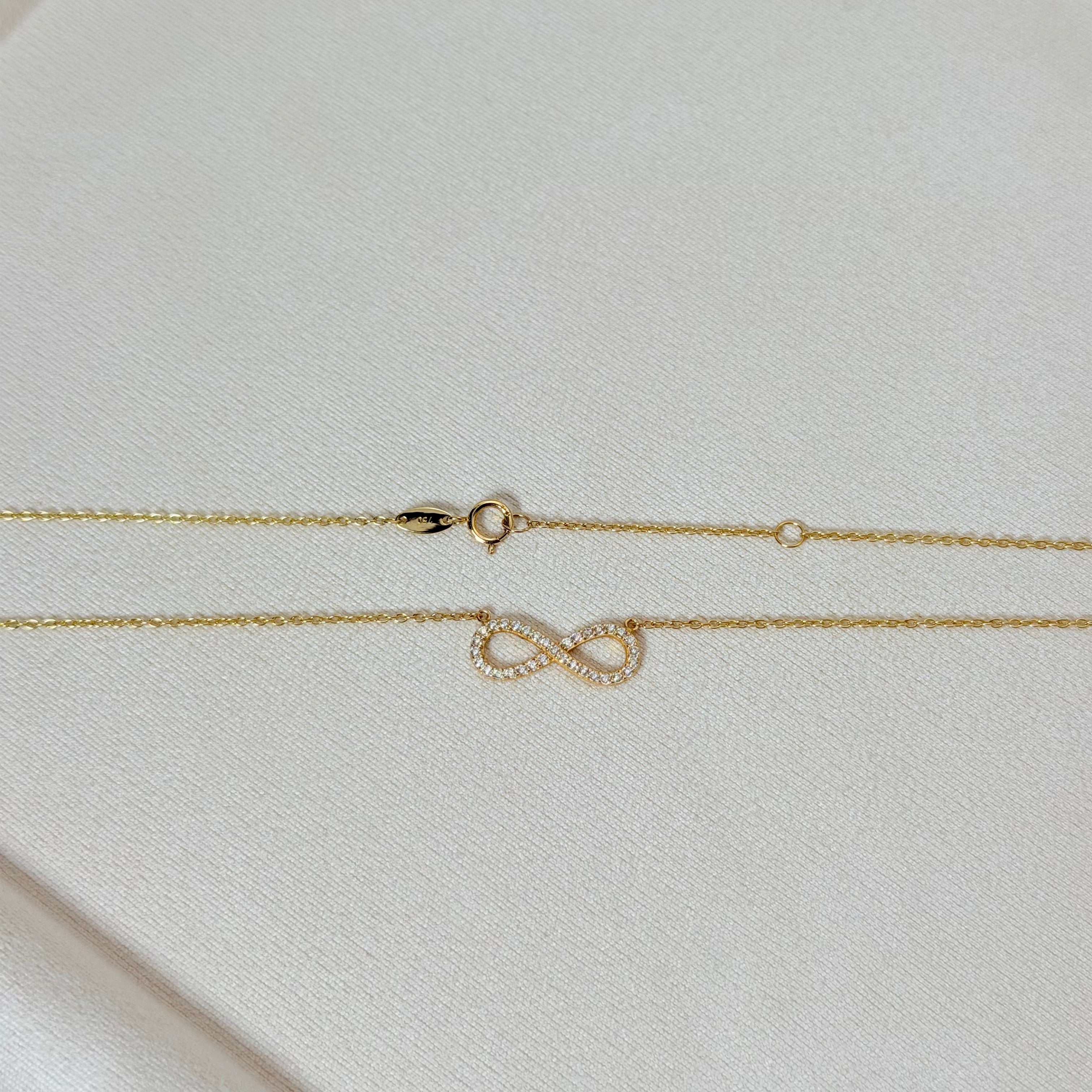 Zirconia Infinity Pendant Necklace in Yellow Gold