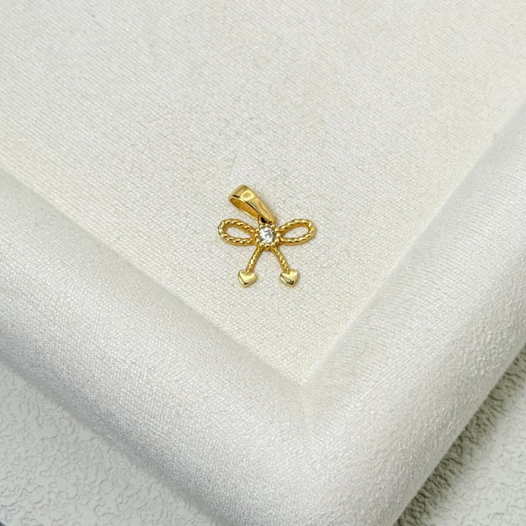 Yellow Gold Zircon Bow Pendant with Heart Accents